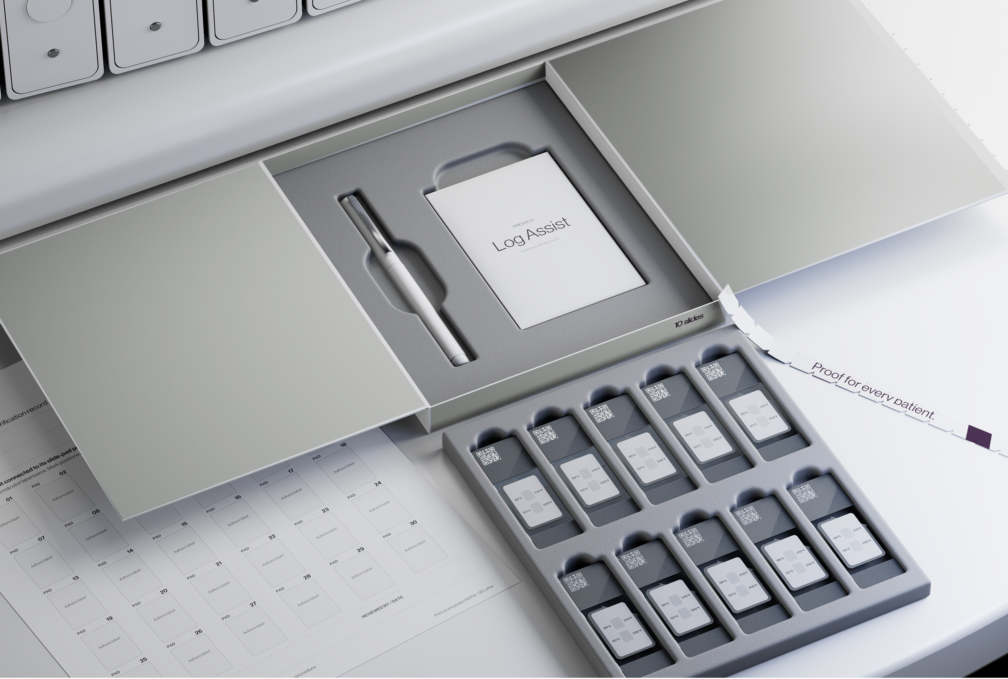 Open Prova V1 kit beside a BenchMark ULTRA, showing ten verification slides, the lifting tool and Log Assist materials in the updated mineral-gray and satin-plum packaging.